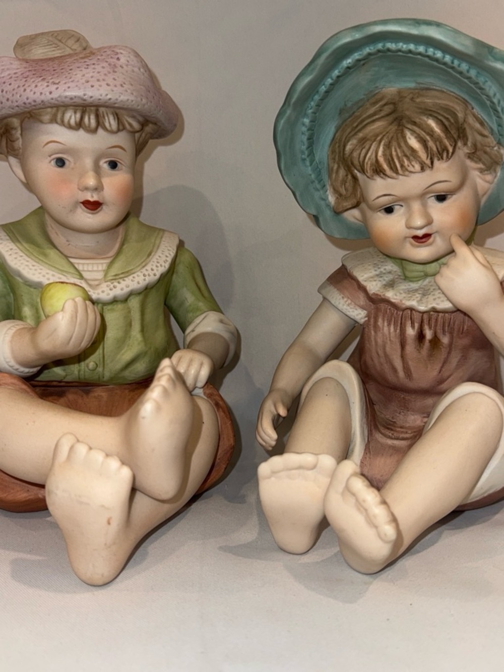 Andrea By Sadek Porcelain Sitting Children Figurines in Green, Pink & Blue